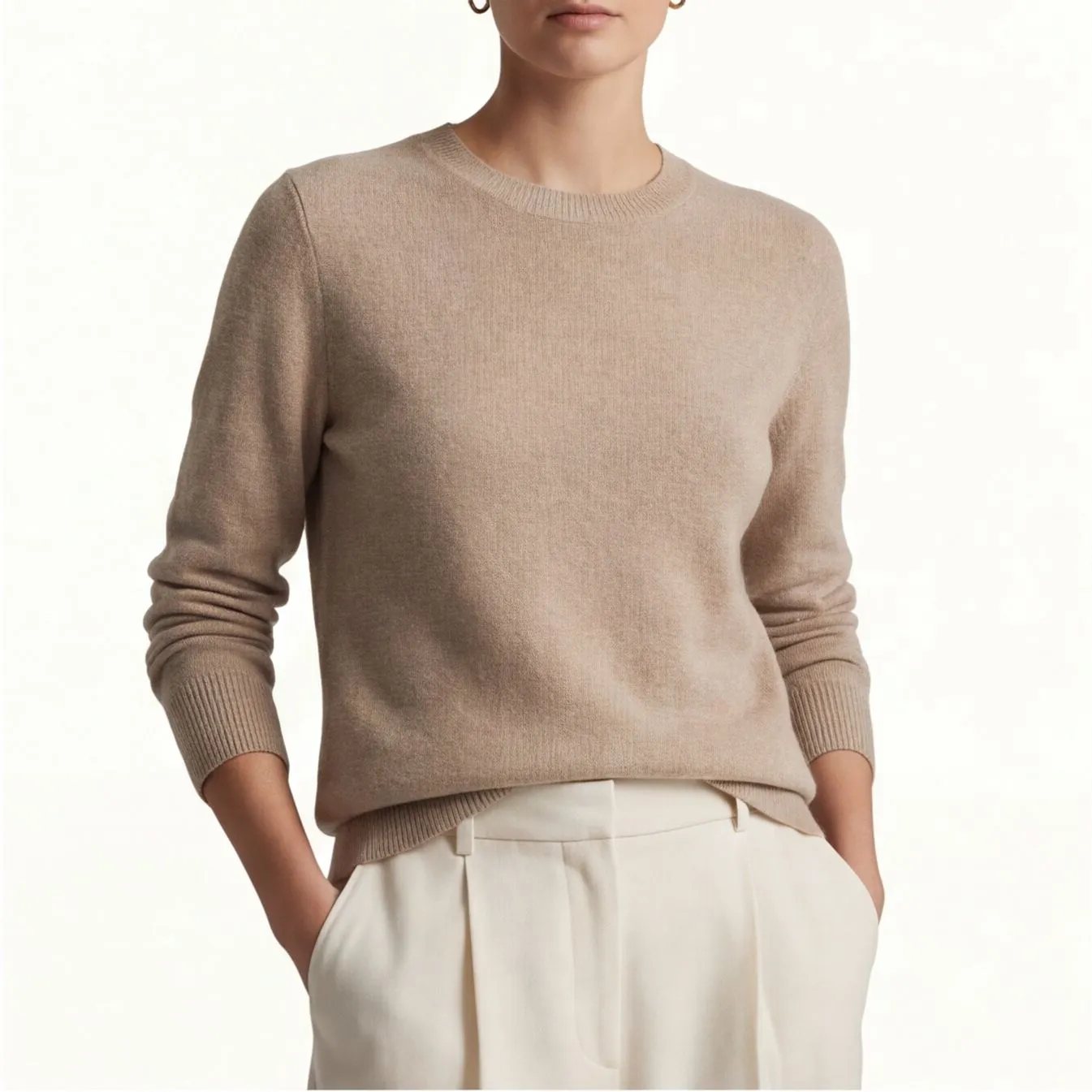 Beige cashmere crewneck sweater with white trousers, consistent catalog styling