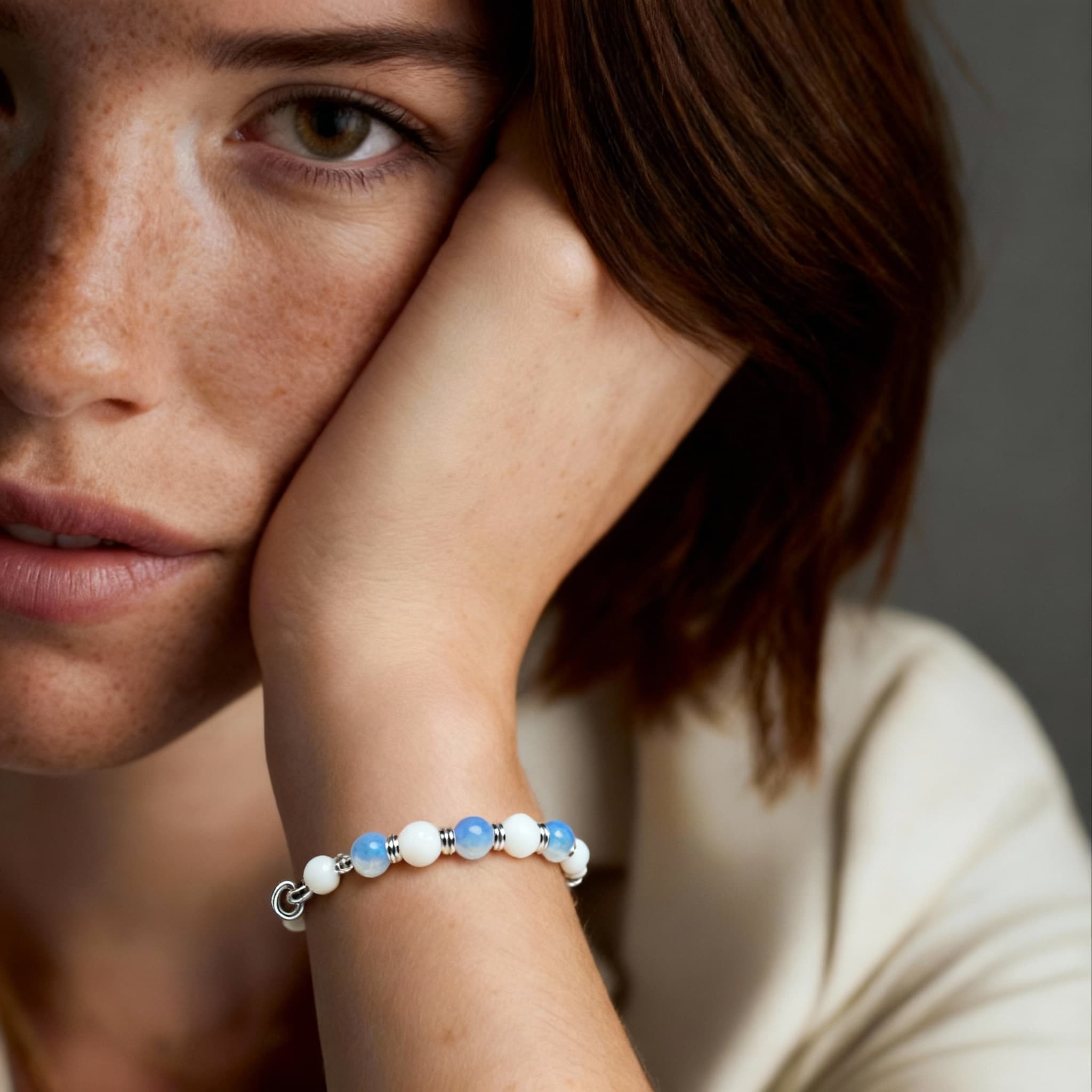 Photorealistic AI beauty editorial showing bracelet in high-fashion close-up portrait with soft focus and professional depth of field