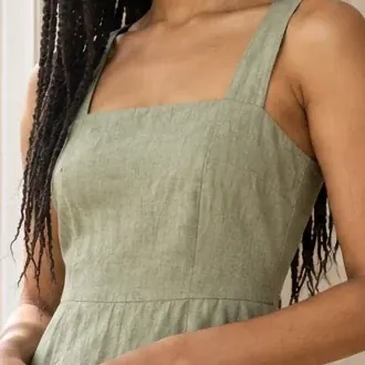 The same straps and neckline, cropped from the photo of the AI fashion model wearing the linen dress.
