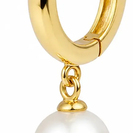 A close crop of the packshot: the gold huggie hinge, bail and pearl drop on white.