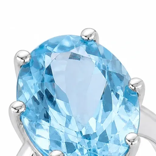 A close crop of the packshot: an oval blue topaz held by six silver prongs.