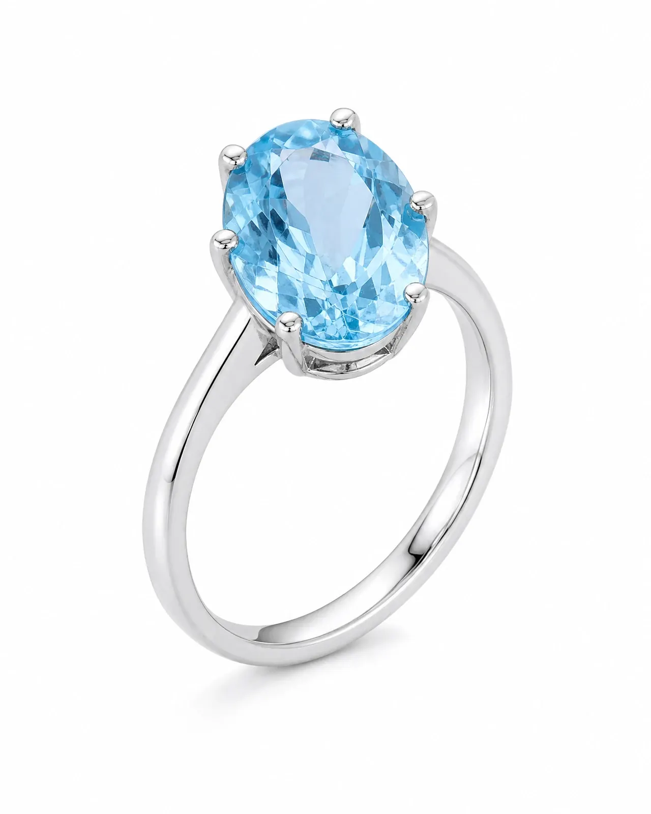 The original packshot: a sterling silver ring with an oval blue topaz standing on white.